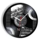 A black wall clock designed like a vinyl record with musical notes, guitar strings, and the words "MUSIC is not what I do, it's who I am.